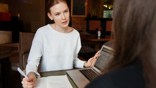 A woman advising another person